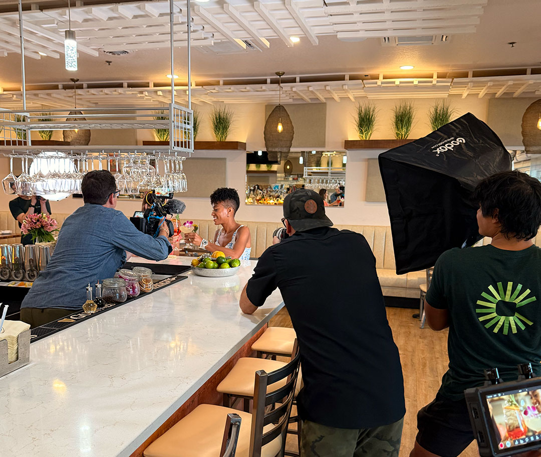 Behind the scenes of a photo and video production at a restaurant